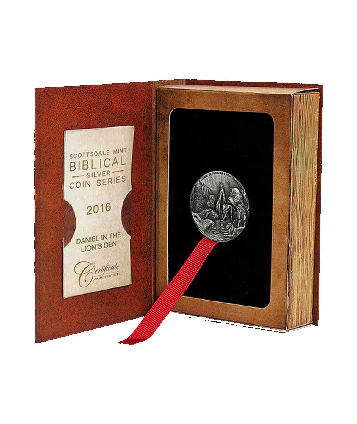 Caja de la moneda Daniel en el Foso de los Leones abierta, con un sello de certificación y el diseño de la cruz de la moneda
