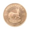 Perspectiva frontal de la cruz de la moneda de oro Krugerrand de 1oz de 1977, con la imagen del antílope