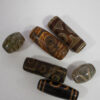 lote-5-amuletos-tibetanos-dzi Lote de 5 amuletos tibetanos DZI
