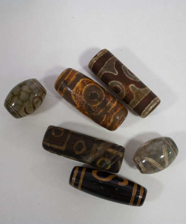 lote-5-amuletos-tibetanos-dzi Lote de 5 amuletos tibetanos DZI